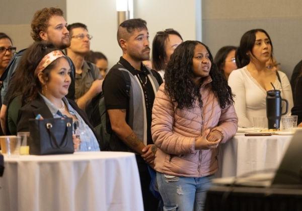 Group of people listening while standing